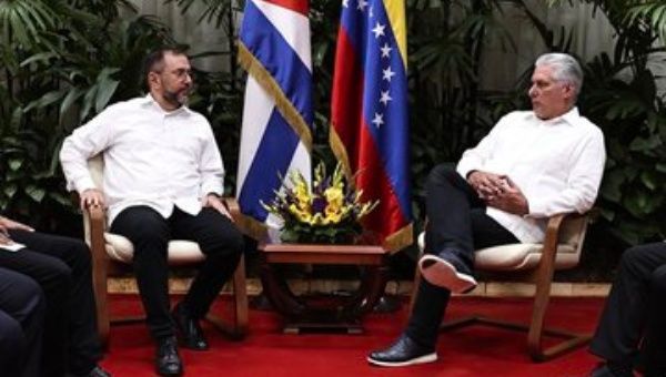 Minister Yvan Gil (R) in the meeting with the President Diaz-Canel (L)