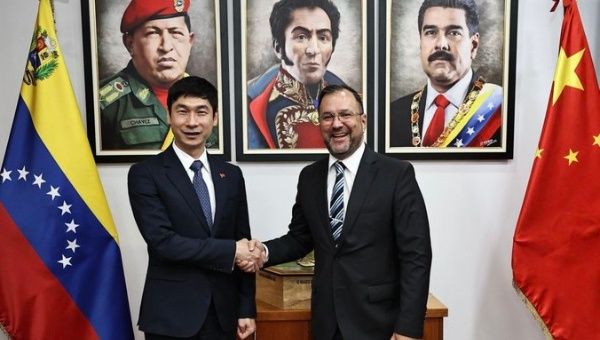 Chinese Ambassador Lan Hu (L) & Venezuelan Foreign Minister Yvan Gil (R) in Caracas, March 22, 2024.