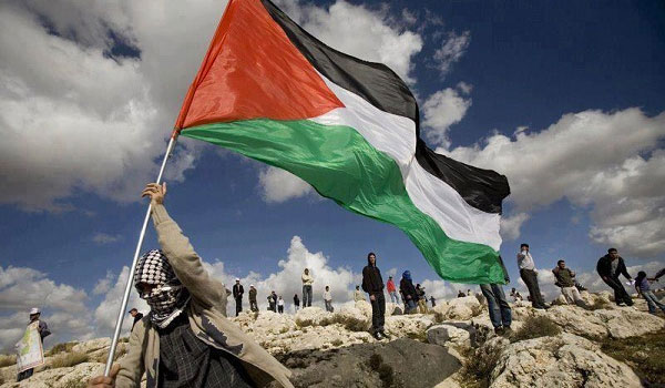 Palestinian Citizen Rises Flag of Palestine, May 2024